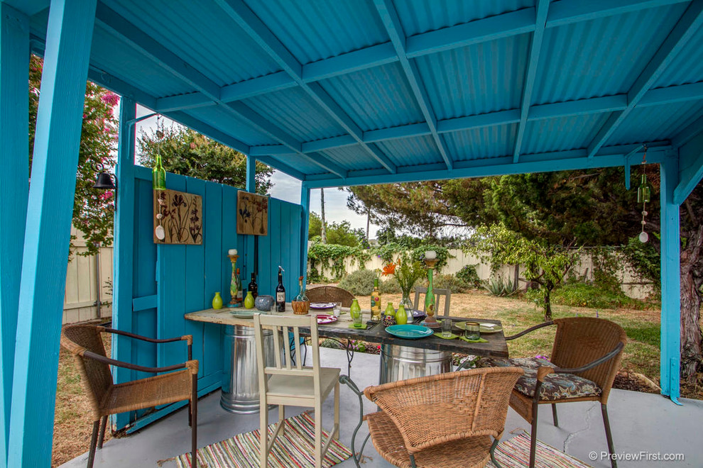 Inspiration for a medium sized bohemian back patio in San Diego with concrete slabs and a gazebo.