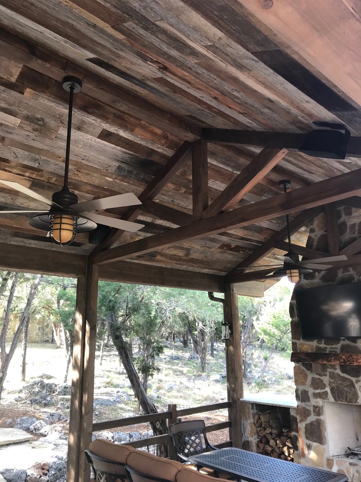 This is an example of a medium sized rustic back patio in Other with a gazebo.