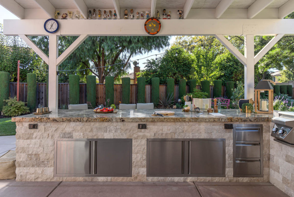 Large transitional backyard concrete patio kitchen photo in San Francisco with a pergola