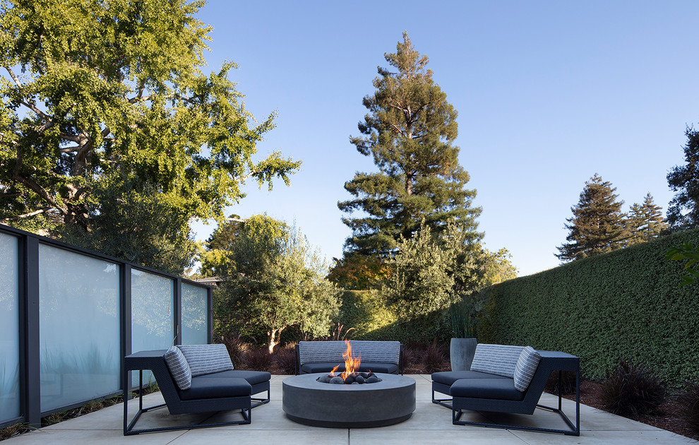 Design ideas for a contemporary patio in San Francisco with a fire feature, concrete slabs and no cover.