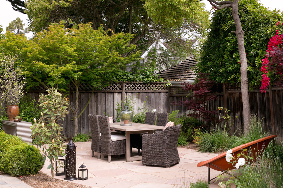 Patio - mid-sized traditional backyard stone patio idea in San Francisco with no cover