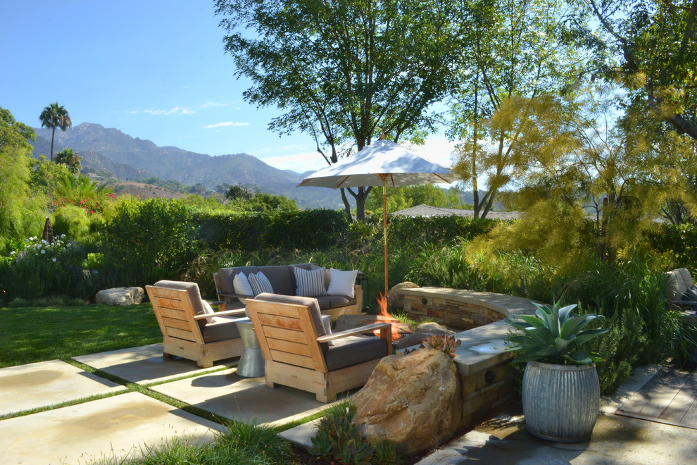 Example of a transitional patio design in San Luis Obispo with a fire pit