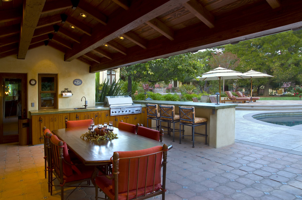 Inspiration for a mediterranean patio in San Francisco with an outdoor kitchen.