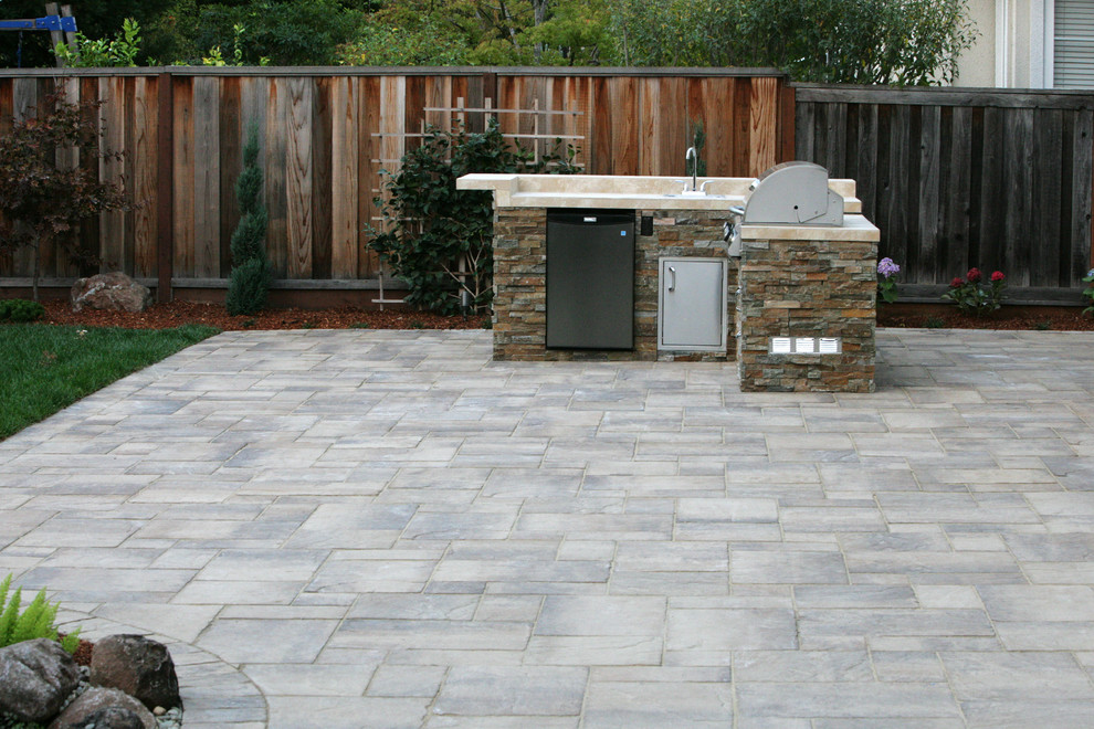Example of a mid-sized trendy backyard patio kitchen design in San Francisco