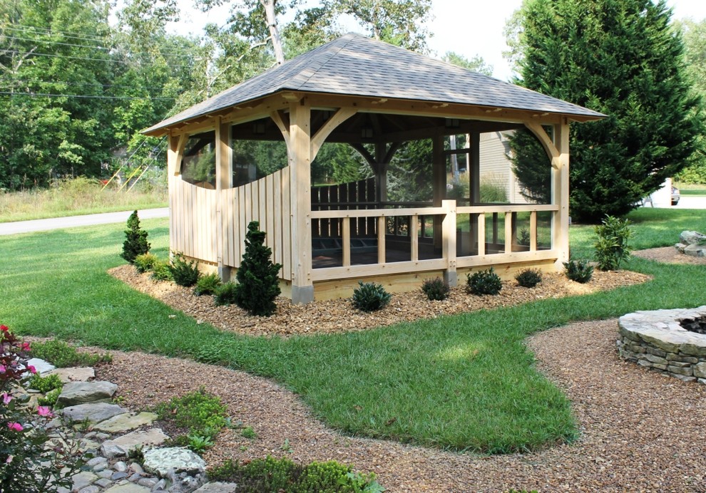 Example of a mid-sized classic backyard patio design in Nashville with a fire pit and a pergola