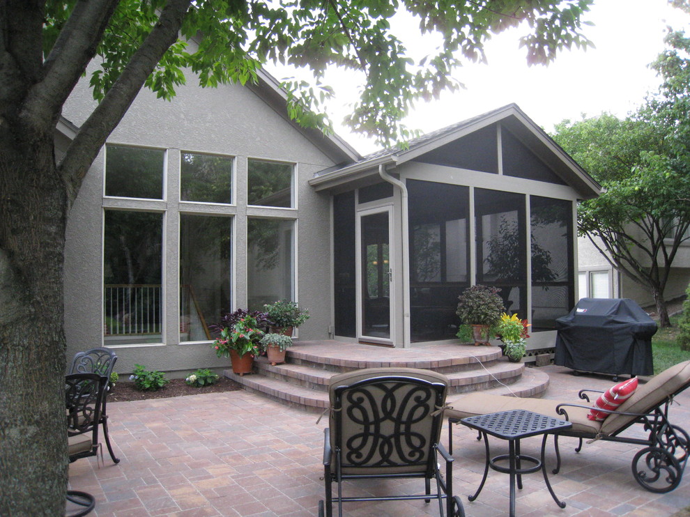 Screened porch and paver patio in Overland Park KS Traditional