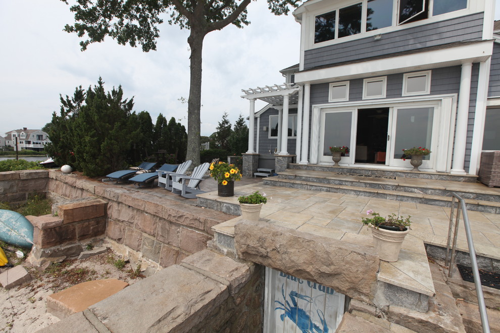 SEA LEVEL LIVING Beach Style Patio Bridgeport by The Outdoor
