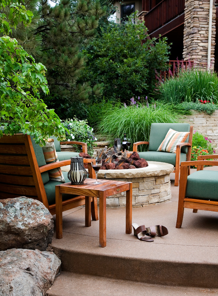 Elegant patio photo in Denver with a fire pit