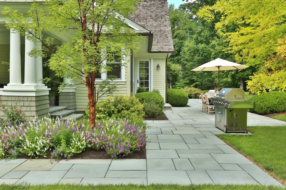Inspiration for a classic side patio in New York with concrete paving, no cover and a bbq area.