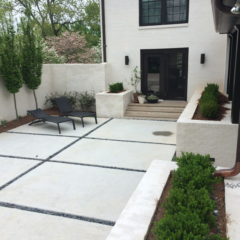Patio - mid-sized traditional backyard concrete paver patio idea in Nashville with no cover