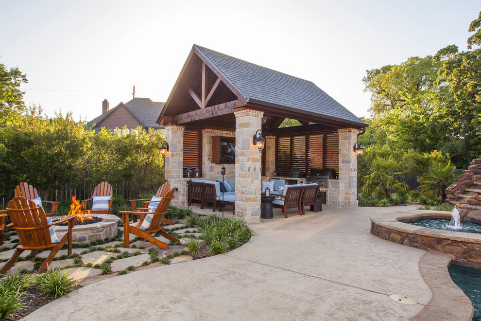 Inspiration for a medium sized rustic back patio in Dallas with an outdoor kitchen, concrete slabs and a gazebo.