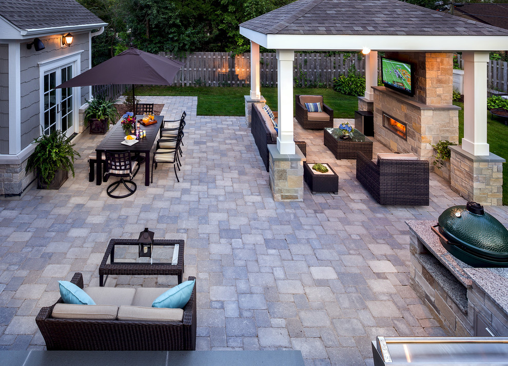 Inspiration for a classic back patio in Chicago with a fire feature, concrete paving and a gazebo.
