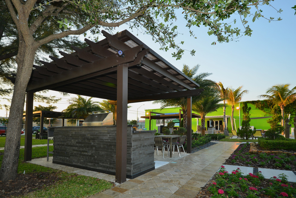 Patio kitchen - contemporary backyard patio kitchen idea in Miami
