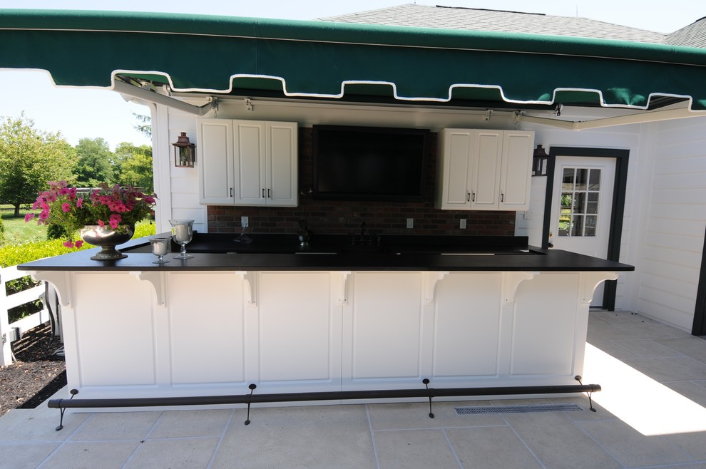 Patio kitchen - mid-sized traditional backyard tile patio kitchen idea in Louisville with an awning