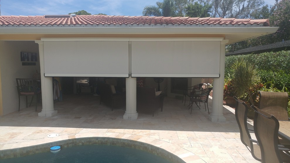 Mid-sized island style backyard tile patio kitchen photo in Tampa with a roof extension