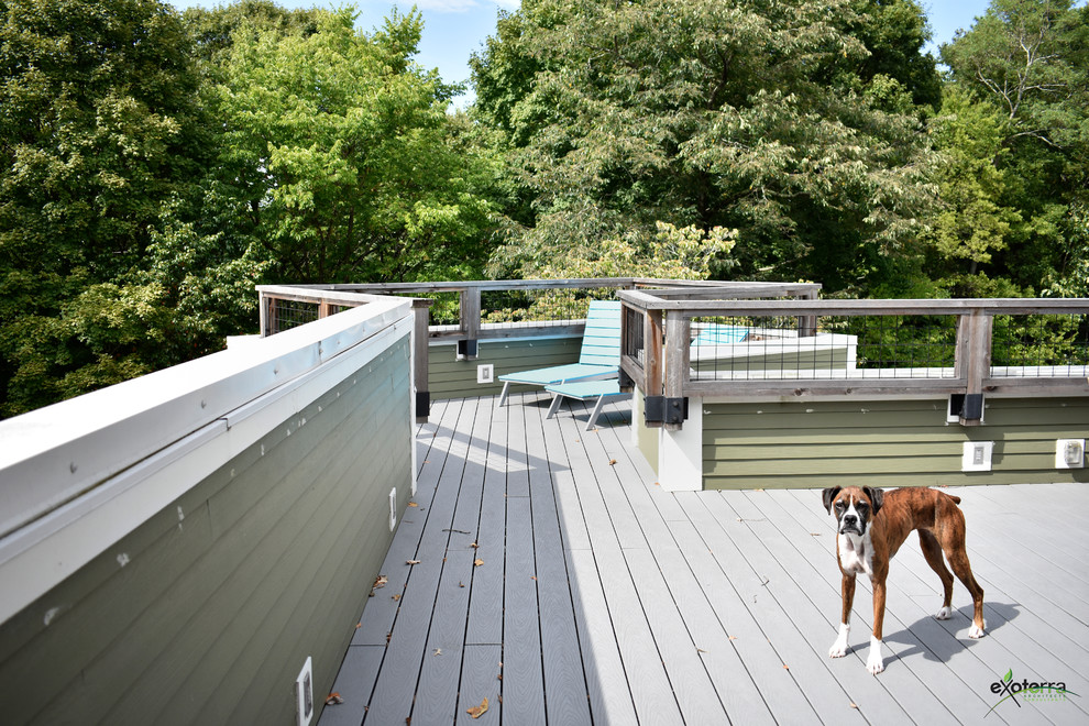 This is an example of a large contemporary patio in Nashville with decking and no cover.