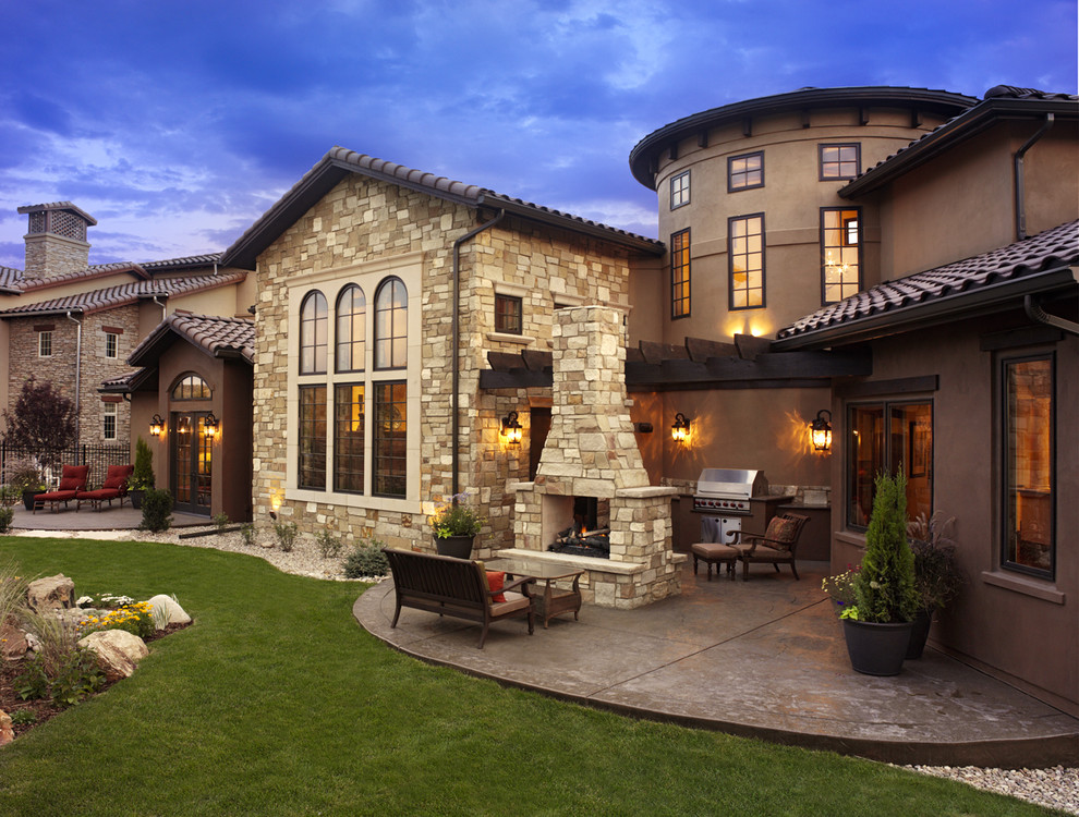 Patio - mid-sized traditional backyard stamped concrete patio idea in Denver with a fire pit and a pergola