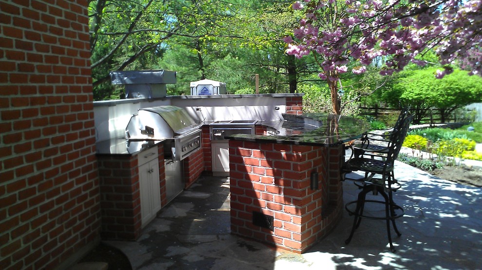 Mid-sized elegant backyard concrete patio kitchen photo in Philadelphia with no cover