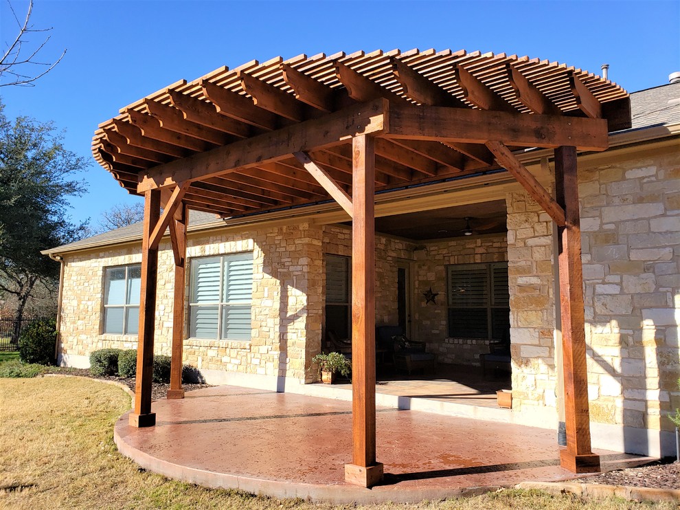 Inspiration for a small bohemian back patio in Austin with an outdoor kitchen and a pergola.