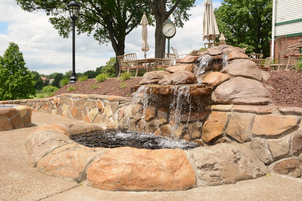 Patio fountain - large traditional courtyard stamped concrete patio fountain idea in Other