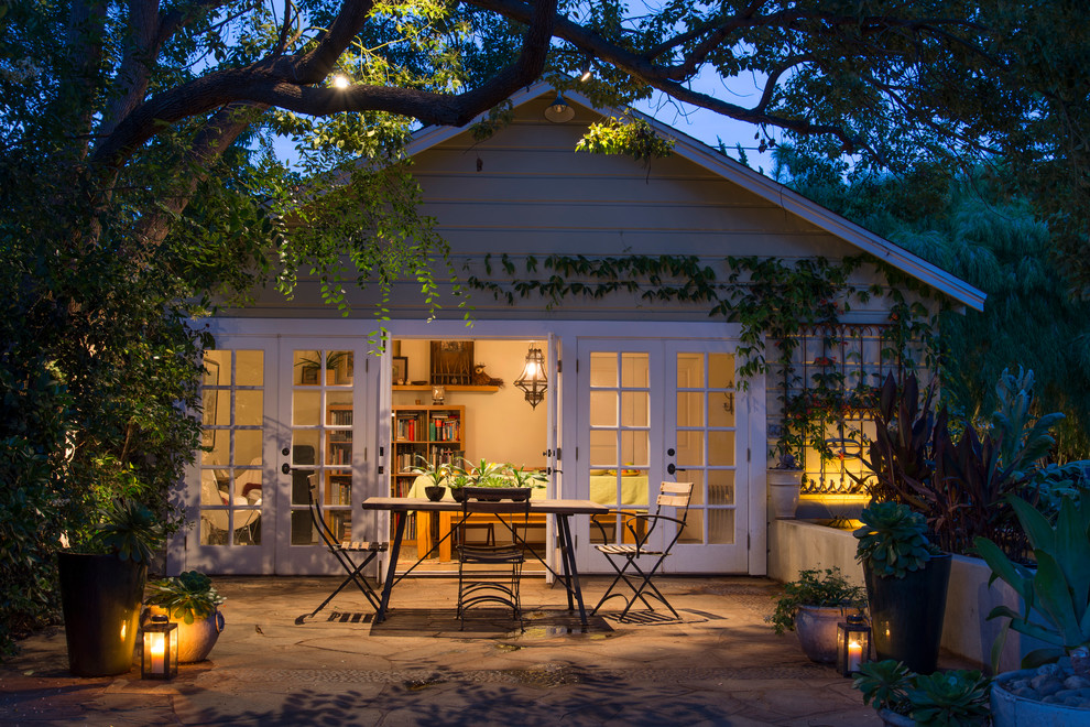Patio - small transitional backyard stone patio idea in Los Angeles with no cover