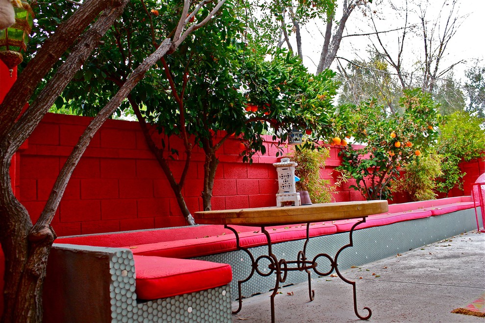 Inspiration for a small eclectic back patio in Phoenix with a vegetable patch, concrete slabs and no cover.