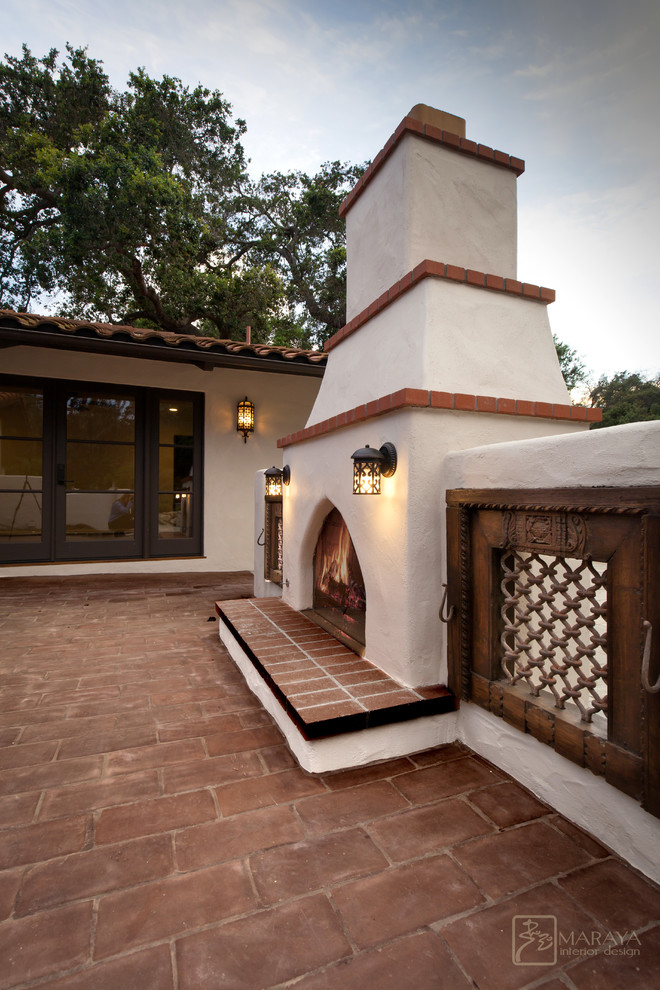 Example of a mid-sized tuscan courtyard brick patio design in Santa Barbara