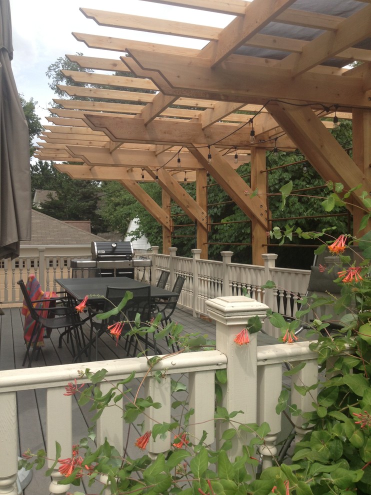 Inspiration for a mid-sized timeless backyard patio vertical garden remodel in Minneapolis with decking and a pergola