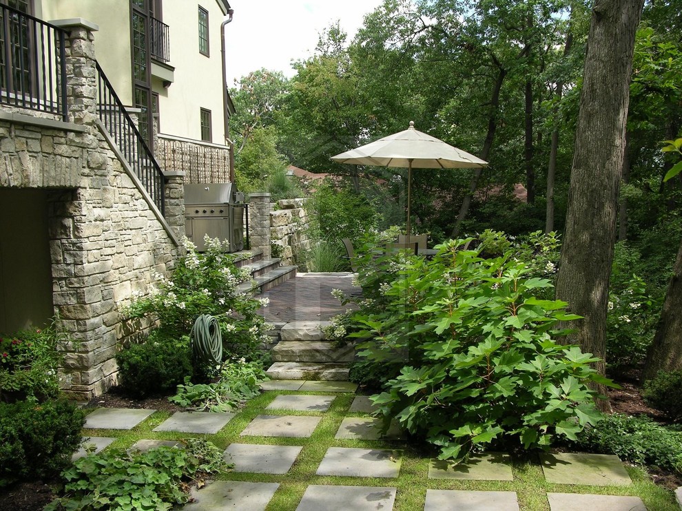 Patio - traditional backyard stone patio idea in Chicago