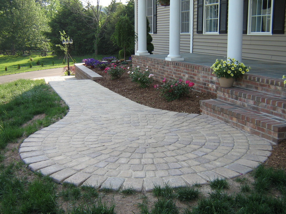 Photo of a large classic front patio in Bridgeport with brick paving and no cover.