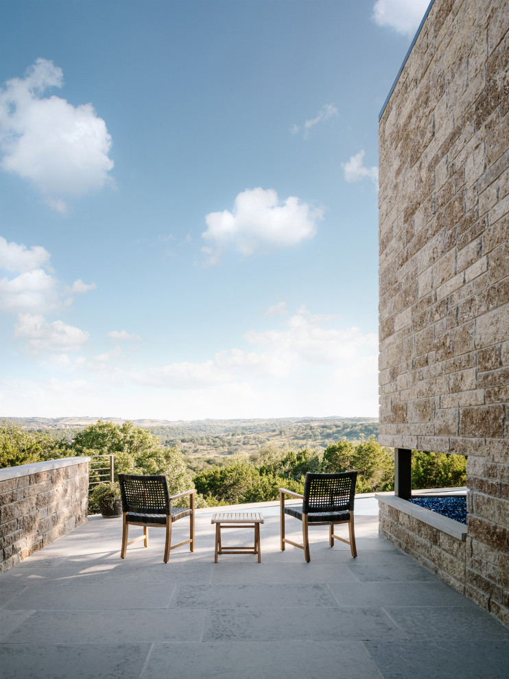 This is an example of a rustic patio in Austin.