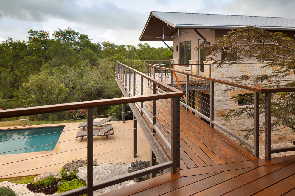 Example of a trendy patio design in Austin with decking