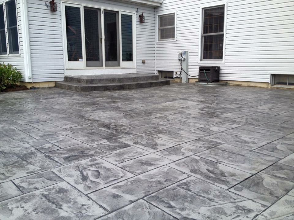 Inspiration for a medium sized classic back patio in Chicago with no cover and stamped concrete.