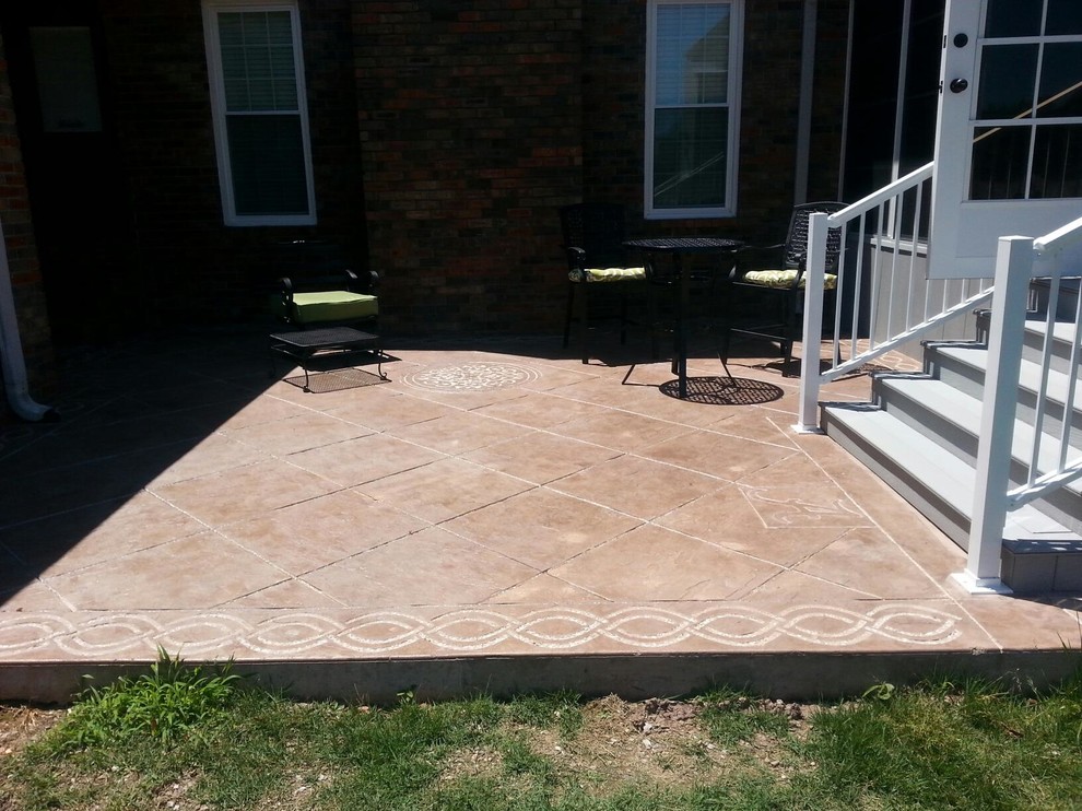 Design ideas for a medium sized contemporary back patio in Other with stamped concrete and no cover.
