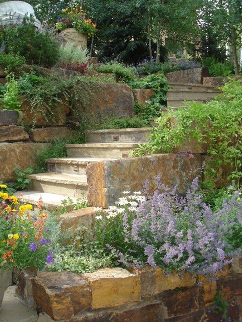 Steps in natural stone retaining wall - Traditional - Garden - Denver ...