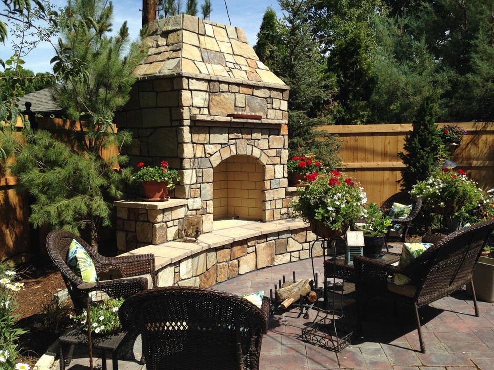 Design ideas for a medium sized mediterranean back patio in Boise with a fire feature, concrete paving and no cover.