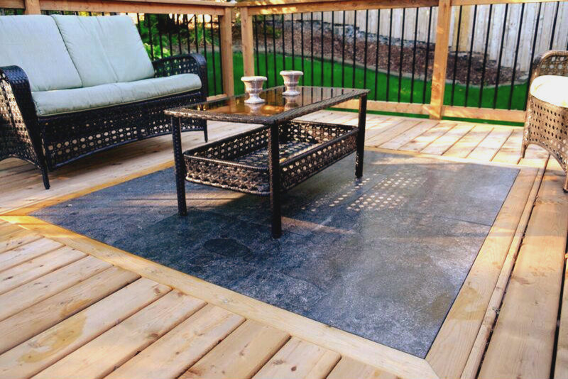 This is an example of a medium sized classic back patio in Other with an outdoor kitchen, decking and no cover.