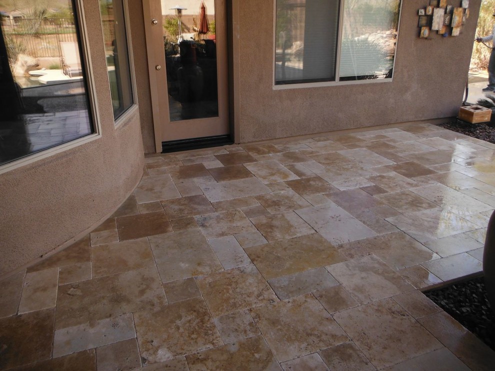 Inspiration for a medium sized front patio in Phoenix with tiled flooring and an awning.