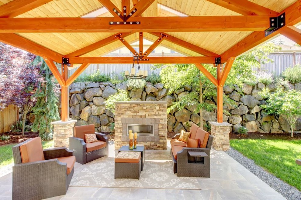 Large transitional backyard tile patio photo in Charlotte with a fire pit and a gazebo