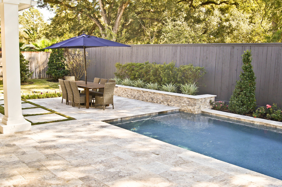 Inspiration for a small modern back patio in Houston with an outdoor kitchen, natural stone paving and no cover.