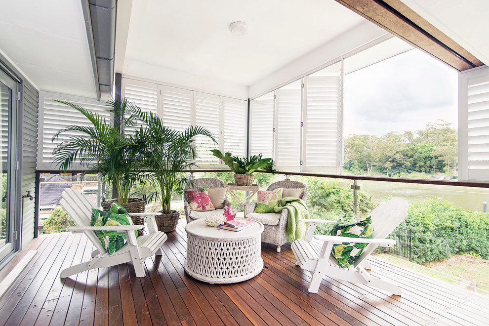 Inspiration for a large classic back patio in Brisbane with decking and a roof extension.