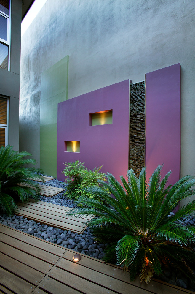 Inspiration for a small contemporary courtyard patio in Perth with decking.