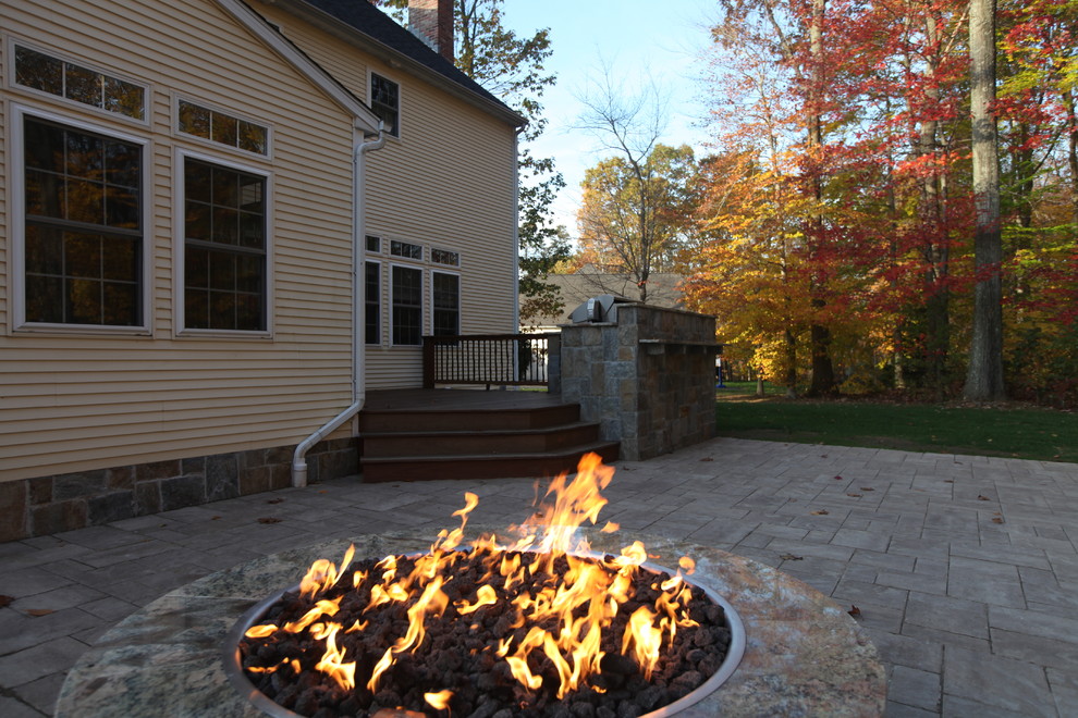 This is an example of a traditional patio in Bridgeport with a fire feature.