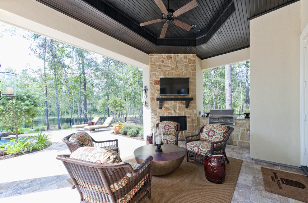 This is an example of a contemporary patio in Houston with a fire feature.