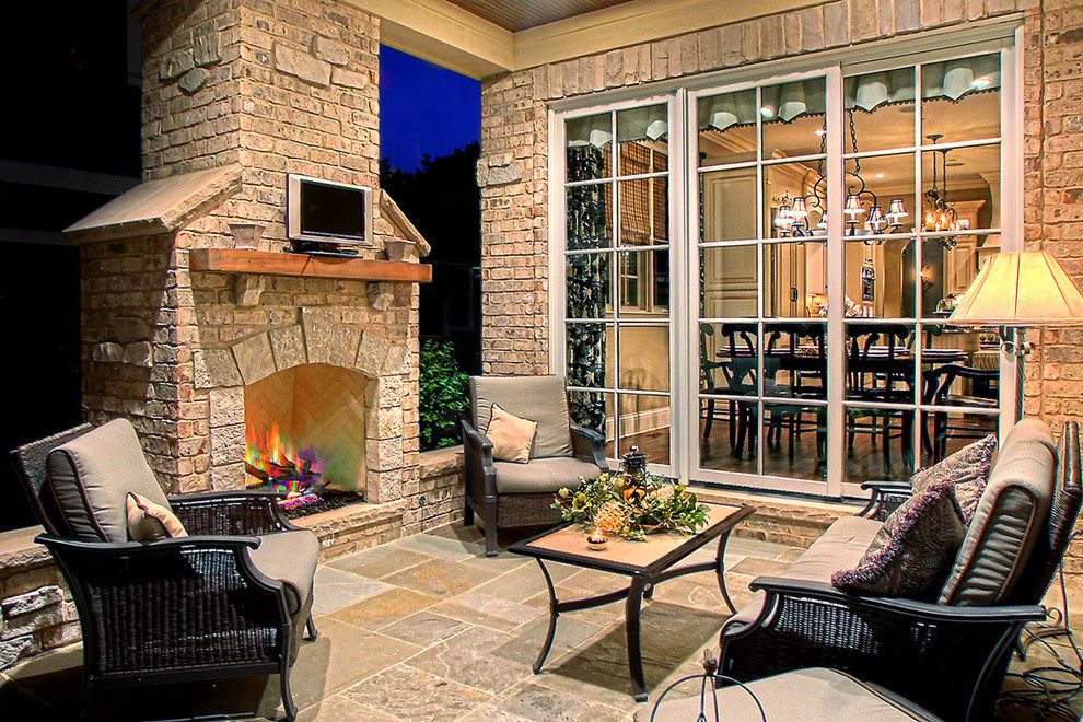 Inspiration for a large classic back patio in Chicago with tiled flooring, no cover and a fire feature.