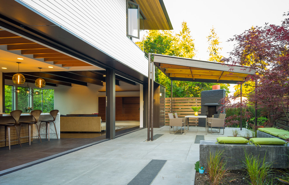 Inspiration for a contemporary courtyard patio remodel in Seattle with a gazebo