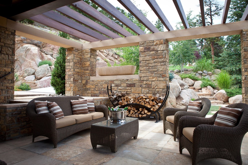Patio - mid-sized transitional backyard tile patio idea in Denver with a pergola
