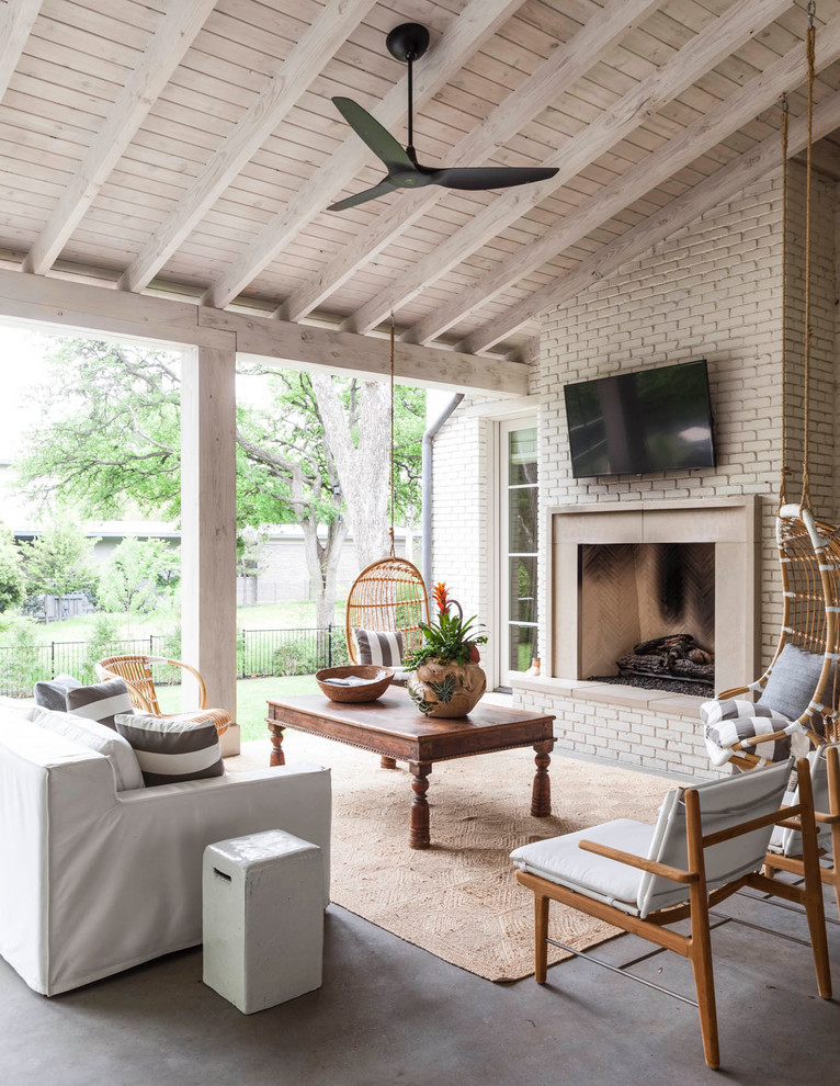 Traditional patio in Dallas with a fireplace.