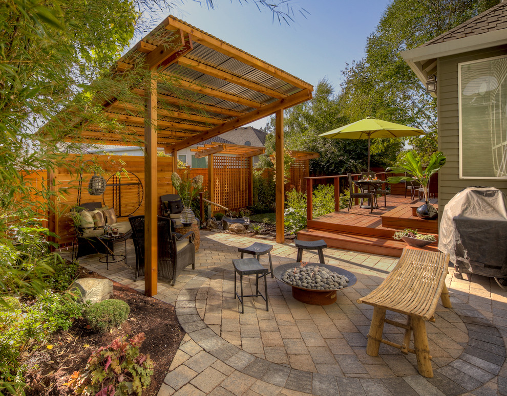 Photo of a traditional patio in Portland with brick paving and a fire feature.