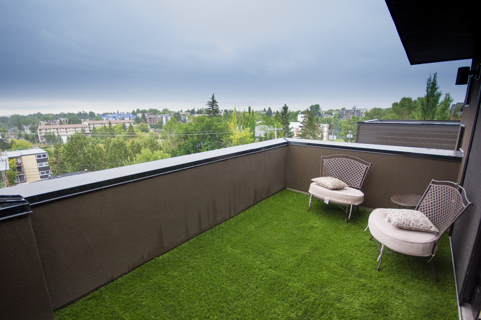 This is an example of a small contemporary back patio in Calgary.
